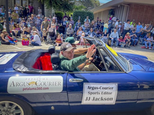 JJ Jackson, the Petaluma Argus-Courier sports editor waves to the crowd at the Butter and Egg parade. Photographed  on April 23, 2022._(CRISSY PASCUAL/ARGUS-COURIER STAFF)