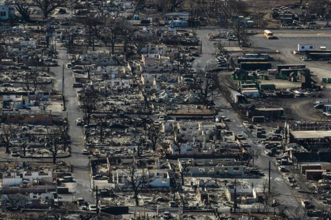 FILE - A general view shows the aftermath of a wildfire in Lahaina, Hawaii, Thursday, Aug. 17, 2023. In the aftermath of the deadly Maui wildfires, some social media users are discouraging residents from accepting disaster aid by falsely claiming the Federal Emergency Management Agency could seize their property if they do. (AP Photo/Jae C. Hong, File)