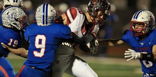 Clear Lake ball carrier Cody Hayes tries for more yardage against St. Vincent defenders Nico Anto<em></em>nini (19), Malcolm Rooks (9) and Jack Davis, during the Cardinals’ 56-55 win over the Mustangs, Saturday, Nov. 26, 2022 at Rancho Cotate High School in Rohnert Park. (Kent Porter / The Press Democrat)