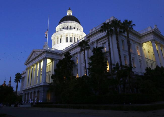 The lights of the Capitol dome shine Friday, Aug. 31, 2018, in Sacramento. (AP Photo/Rich Pedroncelli, File)