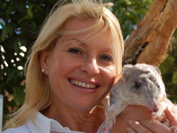 TV presenter Stacey Thomson aka Ranger Stacey posing with bilby animal in promotion for TV program 'Bilby Dreams'.