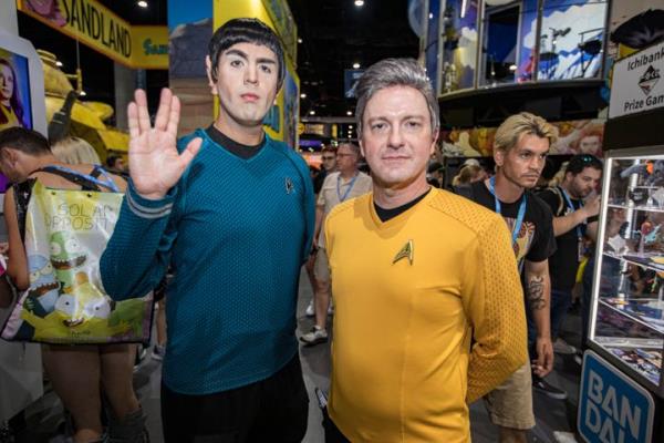 Cosplayers John Hickey as Batman (right) and Mark Fidelak as Robin pose at Comic-Con Internatio<em></em>nal 2023.