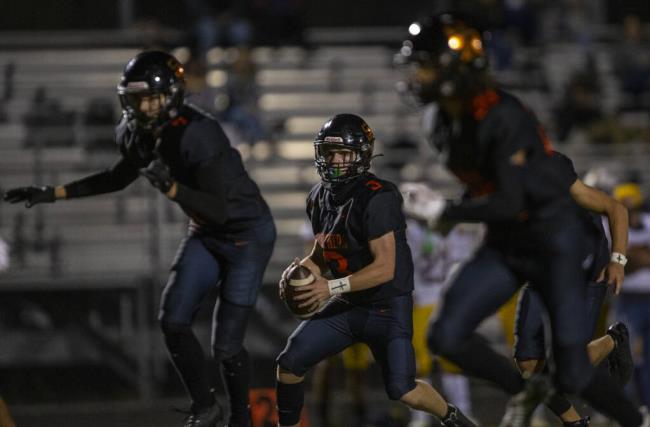 Santa Rosa High’s Nolan Bankston has plenty of offensive line protection while looking for a receiver during a Sept. 16, 202 game against Ukiah in Santa Rosa. (Chad Surmick / The Press Democrat)