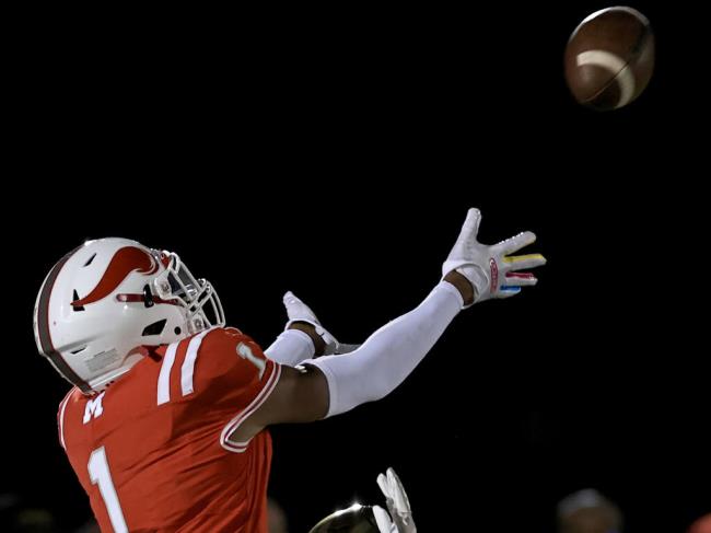 Montgomery’s Izeyah Wright goes high to catch a pass against Casa Grande, Friday, Sept. 16, 2022 at Mo<em></em>ntgomery High School in Santa Rosa. (Kent Porter / The Press Democrat)