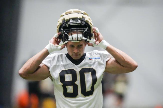 New Orleans Saints tight end Jimmy Graham (80) dons his helmet at the NFL team's football training camp in me<em></em>tairie, La., Friday, Aug. 4, 2023. (AP Photo/Gerald Herbert)