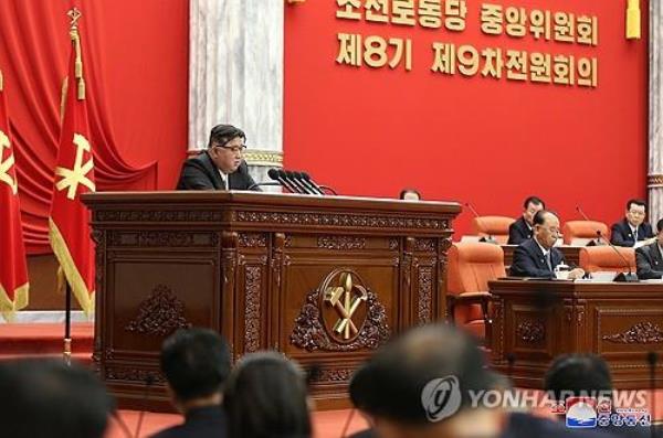 This photo, carried by North Korea's Korean Central News Agency on Dec. 28, 2023, shows the North's leader Kim Jong-un (L) attending the ninth plenary meeting of the eighth Central Committee of the ruling Workers' Party of Korea the previous day. (For Use o<em></em>nly in the Republic of Korea. No Redistribution) (Yonhap)